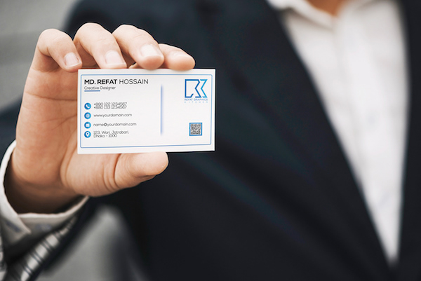 Man holding business card